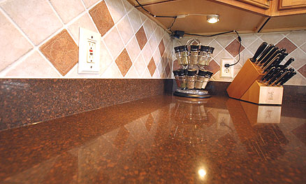 Quartz countertops with marble backsplashes