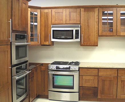 Shaker style kitchen cabinets with stainless steel appliances
