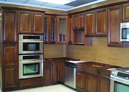 Dark walnut kitchen cabinets in combination with stainless steel appliances