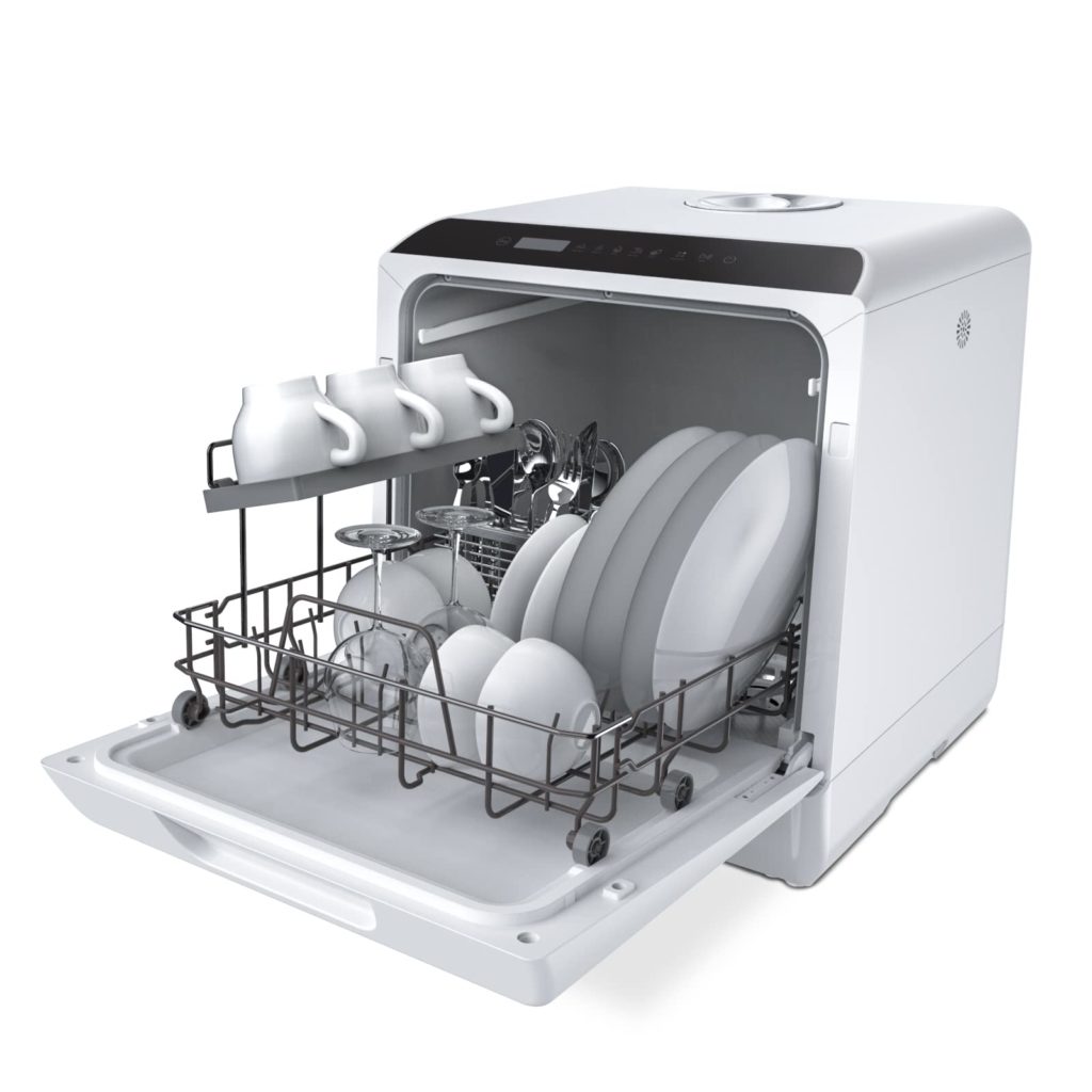 A white compact dishwasher filled with clean plates and cups.